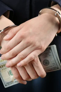 woman holding bail bond money