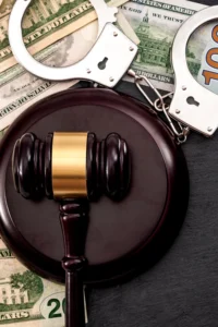 court gavel with bailbond money and handcuffs