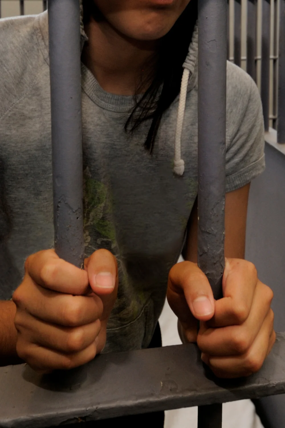 man with hands on the bars